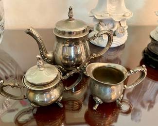 Silverplate Child’s Tea Set with Creamer that has one leg that needs to be put back on. 