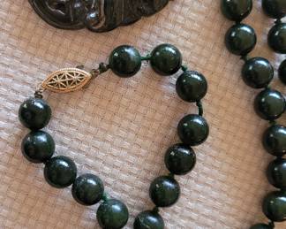 #30 close-up of dark green Jade carved pendant and bead necklace