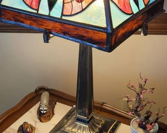 Antique stained glass lamp with butterfly design.  The shade was purchased separately from the base and dates from the 1800's.  
