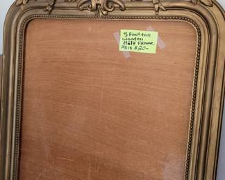 Five foot tall wooden gilt mirror