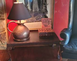 carved table and large antique copper pitcher turned into a lamp