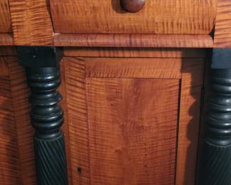 Close-up of tiger maple Empire style sideboard