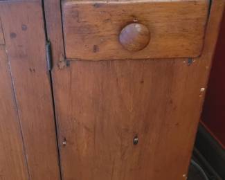 close-up of antique dry sink used as a TV/media cabinet