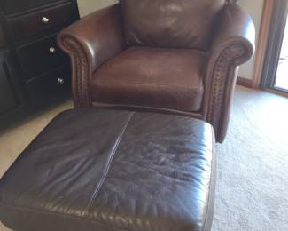 Brown leather chair and ottoman. Not a matched set. Slight color variation.