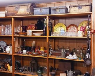 Shelves and shelves of Early American Antiques, bottles, glass, iron and reproductions