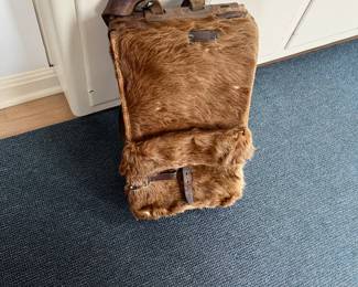 WWII fur covered backpack for sale during in person shopping Friday and Saturday.