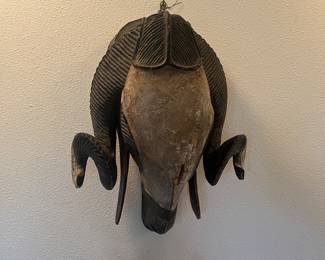 One of two African masks for sale during in-person shopping Friday and Saturday.