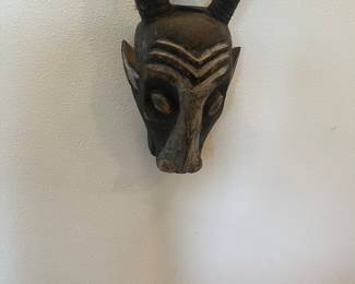 One of two African masks for sale during in-person shopping Friday and Saturday.