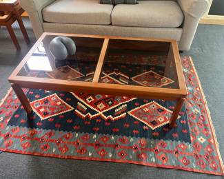 $600. K.T. Nr. coffee table is 47"w x 25"d x 15"h.  Rug is listed in a different photo.  Available for Pre-sell which opens Wednesday April 18th at 9 am.