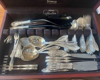 $3600.  Towle "King Richard" sterling service for 10 with serving pieces.  weight is 2554.6 grams not including the weighted handle pieces.  100 pieces including the serving pieces.  10 knives, 10 butter knives, 10 teaspoons, 10 salad forks, 10 dinner forks, 9 tablespoons, 3 serving spoons, bone handled salad servers, 1 serving fork, 2 ladles, 1 cake server. 