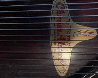 Electric checkmate guitar