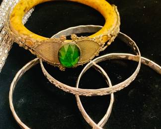 sterling bangles and a 1920's Bakelite bangle with a large rhinestone