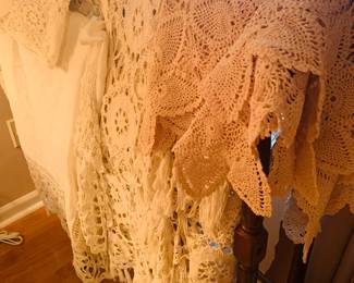 many hand crocheted table cloths, dresser scarves, and mantle scarves