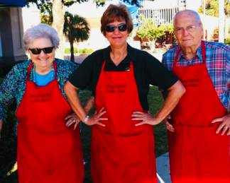 my parents and I working a sale.  I told them to look serious but it was impossible for my mother. 