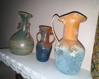 Lots of fun glass!  Florentine?  or maybe Murano... maybe Discover Murano Glass Amphora vases?? 