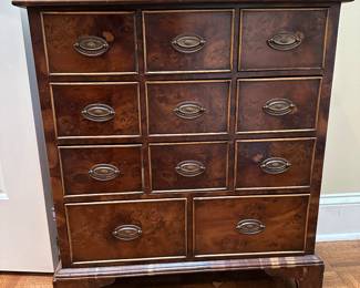 F2 - $275. UK Chemist Apothecary Cabinet. 11 drawers with burled veneer. Measures 10.25" deep x 26.5" wide x 30" tall. All drawers slide. 