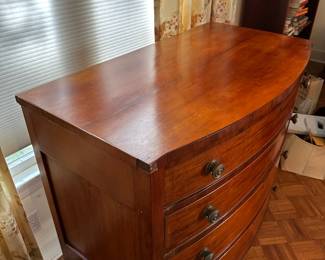 F57 - $325. 4 drawer antique Bowfront Chest. All drawers slide. Does have minor issues on the corners where Veneer is chipped. Still an absolutely gorgeous statement piece or dresser. See photos for closeups. Measures 23.5" deep x 42.25" wide x 40" tall. 