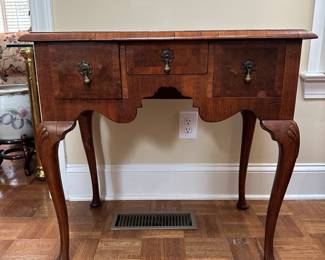 F7 - $175. Queen Anne Style Burl Cross Banded Walnut Lowboy. Measures 17" deep x 29" wide x 28" tall.  Has some veneer pieces missing and a small amount of bubbling. Overall very good antique condition. 