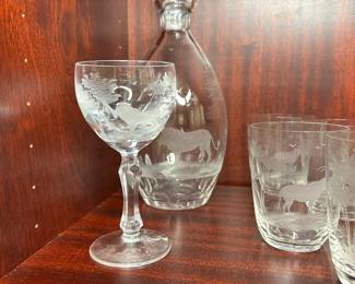 CP4 - $450. 22 Pieces. Rowland Ward Etched Crystal Safari Barware. 11.5" Decanter - Lion. 3.75" Glasses. 2 Giraffe, 3 Water Buffalo , 3 Rhino, 4 Lion, 4 Elephants, 4 Gazelle, 1 - 5.75" Lion Wine Glass. 