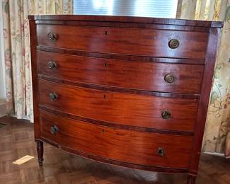 F57 - $325. 4 drawer antique Bowfront Chest. All drawers slide. Does have minor issues on the corners where Veneer is chipped. Still an absolutely gorgeous statement piece or dresser. See photos for closeups. Measures 23.5" deep x 42.25" wide x 40" tall. 