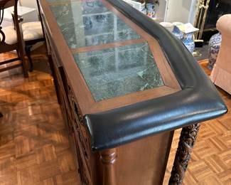 F14 - $750. Hand carved bar. Measures 22.5" deep x 6' wide x 43" tall. Brass foot rest across the bottom. Marble and Leather top. Needs minor repair to door on backside (new screws/wood glue to hold a hinge). Otherwise very good vintage condition. From China or Thailand. BUY IS RESPONSIBLE FOR MOVING. 