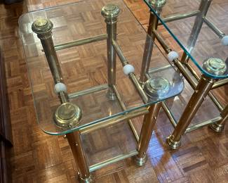 F94 - $125. Pair of Brass & Glass Side Tables. Measures 18" x 24" x 27" tall. 