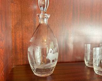 CP4 - $450. 22 Pieces. Rowland Ward Etched Crystal Safari Barware. 11.5" Decanter - Lion. 3.75" Glasses. 2 Giraffe, 3 Water Buffalo , 3 Rhino, 4 Lion, 4 Elephants, 4 Gazelle, 1 - 5.75" Lion Wine Glass. 