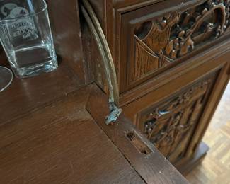 F14 - $750. Hand carved bar. Measures 22.5" deep x 6' wide x 43" tall. Brass foot rest across the bottom. Marble and Leather top. Needs minor repair to door on backside (new screws/wood glue to hold a hinge). Otherwise very good vintage condition. From China or Thailand. BUY IS RESPONSIBLE FOR MOVING. 