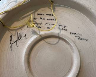 F126 - $350. Measures 19" round. Saim Kolhan signed wall Plate. 