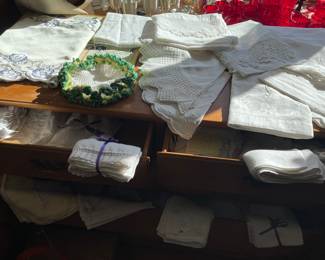 Assorted linens.  Doilies, napkins, tablecloths