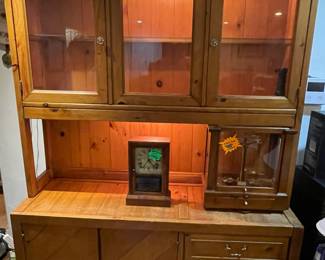 Solid wood display hutch with lighting.