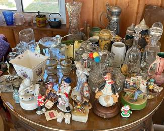 Many assorted collectibles.  Steins, cut crystal and clowns.