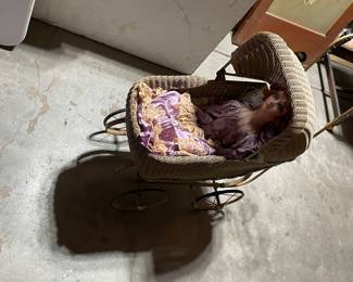 Antique wicker dolly buggy.