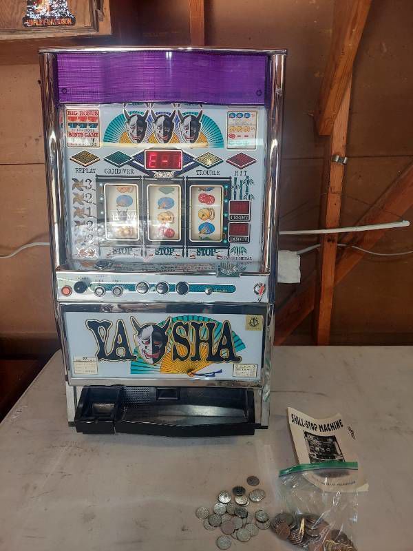slot machine with key and tokens - lights up