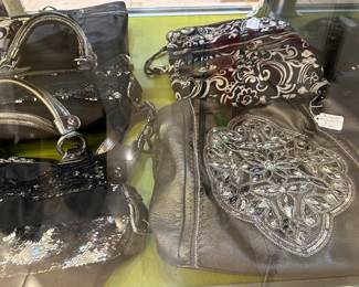 Designer handbags - photo taken outside of display cabinet