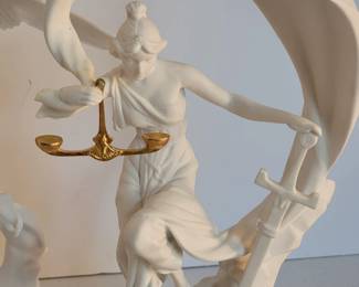 Porcelain justice-themed figures