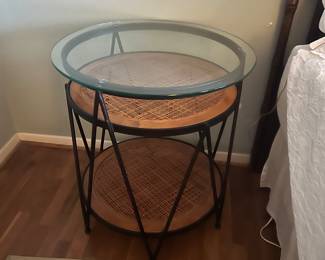 Cane, iron and glass table. 
$350