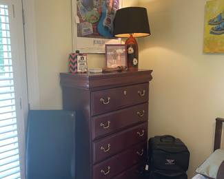 Ashley mahogany chest of drawers and Corvette leather luggage 