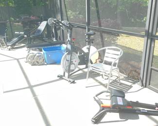View of gym equipment by the pool 