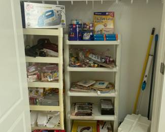 Laundry room closet with Kenmore sewing machine, sewing and cross stitch supplies, art supplies and household miscellaneous 
