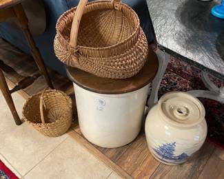 Lidded crock with old baskets 
