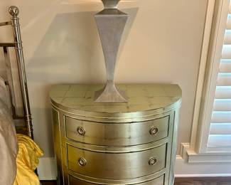Gold tone demilune dresser by Caracole