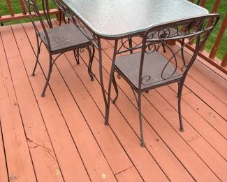 wrought iron table and chairs 