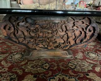 This is a hand carved corbel from Mexico and is the base of the glass top coffee table in the living room