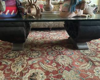 Looking at the coffee table and the hand carved corbels 