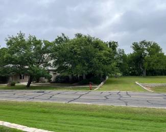 This is the estate house on the left. There is a vacant lot on the right that we will use for parking. See next photo.