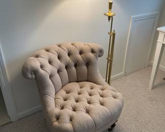 Tufted side chair and brass floor lamp