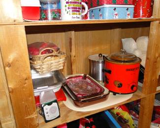 Brand new baking sets, pots and pans, along with a working vintage slow cooker
