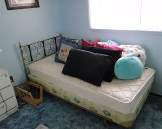Twin bed, lots of fun pillows and an amazing Mid Century Modern Twin headboard.