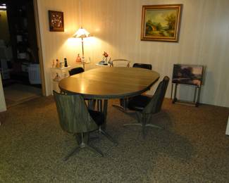 Complete with 4 chairs, and a solid table, this set is in remarkable condition